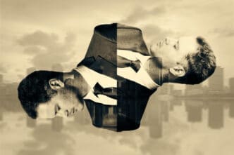 A surreal, split image of two men in suits, facing away from each other and seemingly connected at the torso, with their forms filled with a cityscape, against a monochrome background of a blurred city and sky.