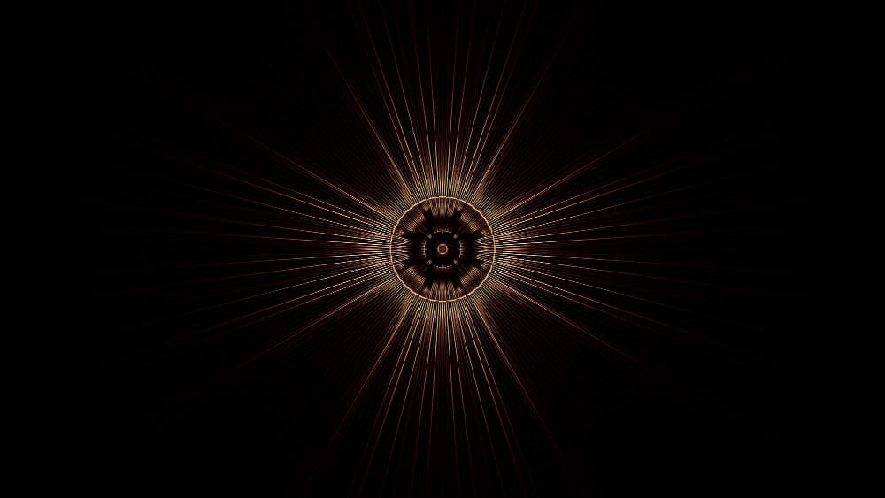 A mesmerizing golden-brown starburst pattern with thin, radiating lines emanating from a detailed circular center, against a deep black background, evoking cosmic or spiritual imagery.