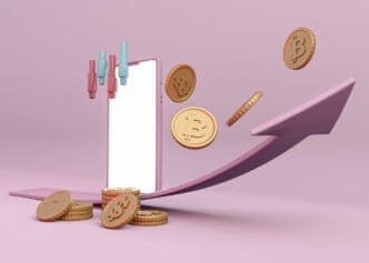 A 3D rendering showing a white smartphone with cryptocurrency and traditional currency coins around its base. A large pink upward-curving arrow signifies growth, with candlestick indicators floating above, all on a pink background.