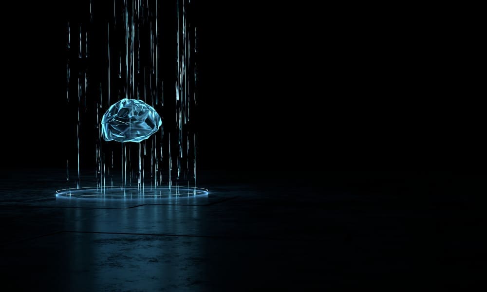 A glowing, polygonal artificial brain being projected upwards by blue digital light beams from a circular platform on a dark, futuristic surface.