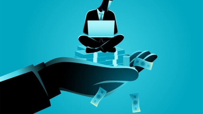 A large, dark silhouette of a hand extends forward, holding a smaller, silhouetted businessman sitting cross-legged on stacks of money, working on a laptop, against a vibrant blue background with falling money.