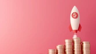 A 3D rendering of a white rocket with red fins and a dollar sign on its side, launching from a stack of golden coins, symbolizing rapid financial growth, all on a pink background.