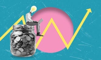 A man with a lightbulb for a head, sitting on a jar of coins and using a laptop, with an upward financial graph and pink circle in the background.