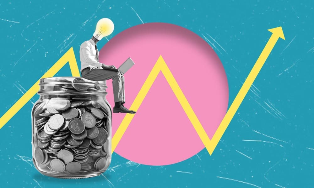 A man with a lightbulb for a head, sitting on a jar of coins and using a laptop, with an upward financial graph and pink circle in the background.