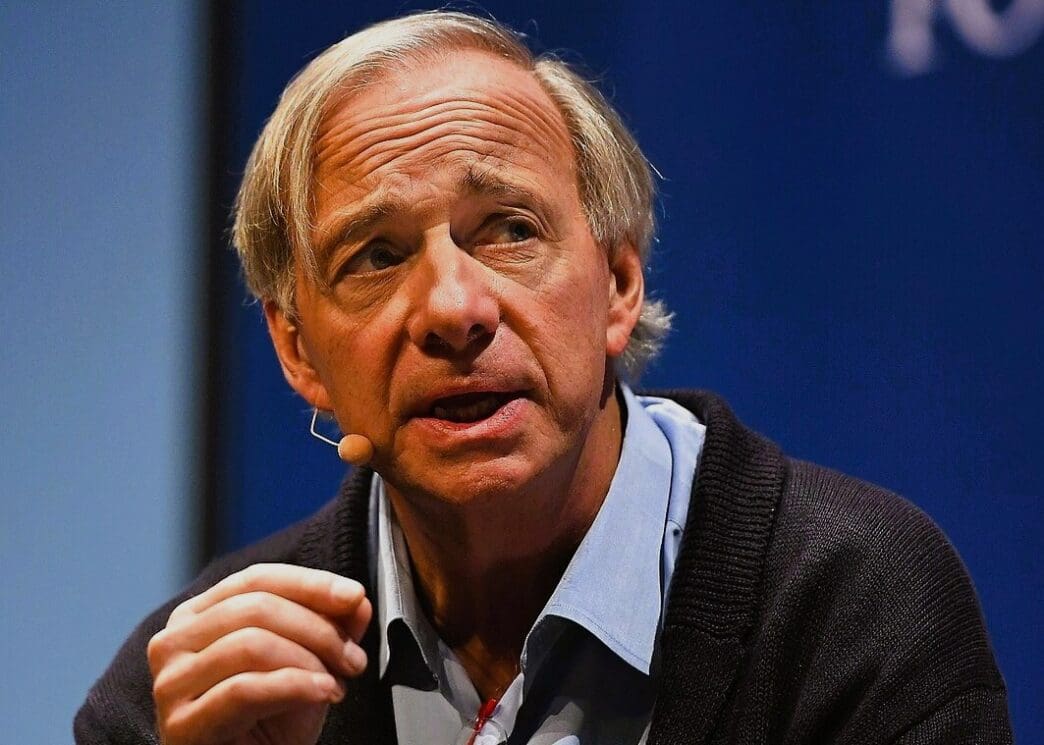 Close-up of Ray Dalio, a man with light hair, speaking into a lapel microphone.