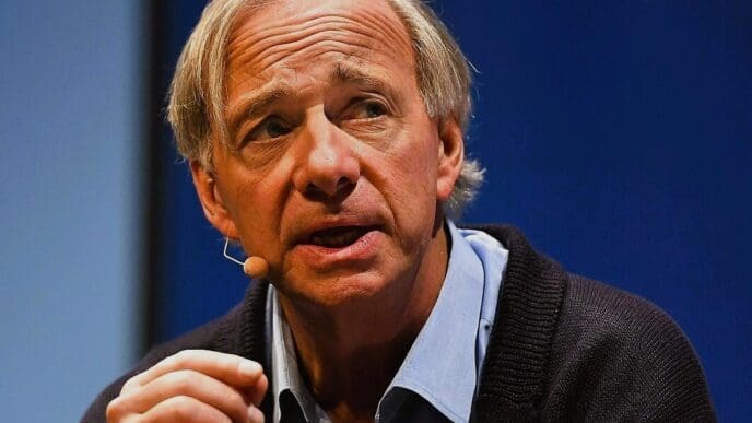 Close-up of Ray Dalio, a man with light hair, speaking into a lapel microphone.