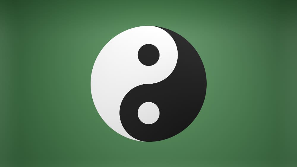 A classic black and white Yin Yang symbol centered on a green background.