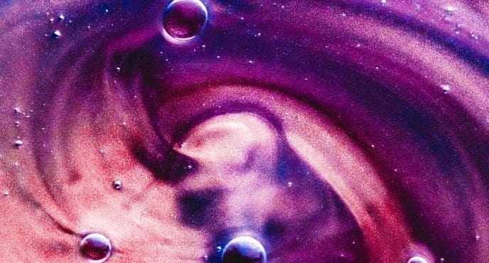 Abstract banner with swirling paint splashes, water drops, and a gel-like texture.