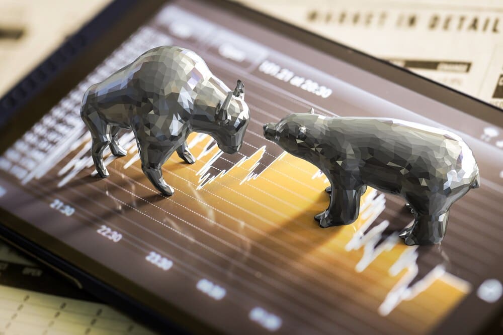 A stock market chart shows both an upward trend representing a bull market and a downward trend representing a bear market.
