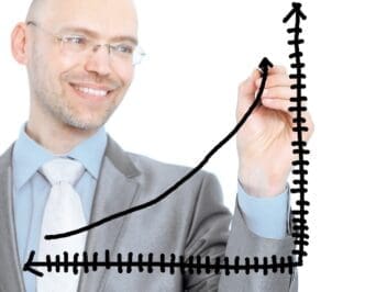 A businessman draws a graph on a white background.