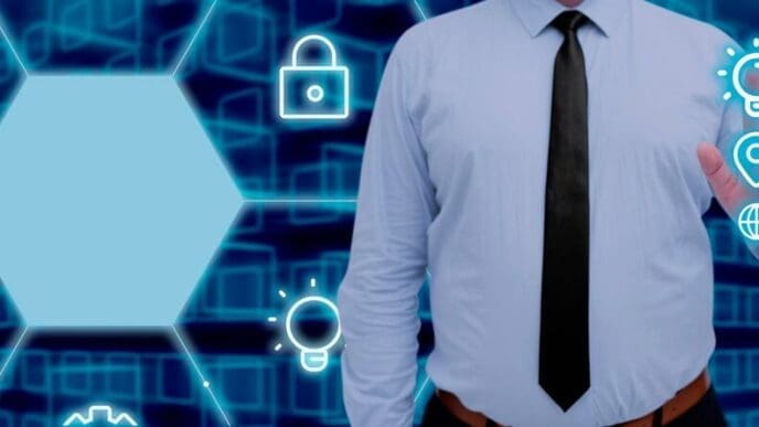 A businessman points to a digital screen displaying data and symbols in a futuristic pattern.