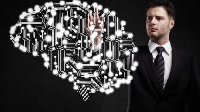 A businessman's finger presses a circuit board.