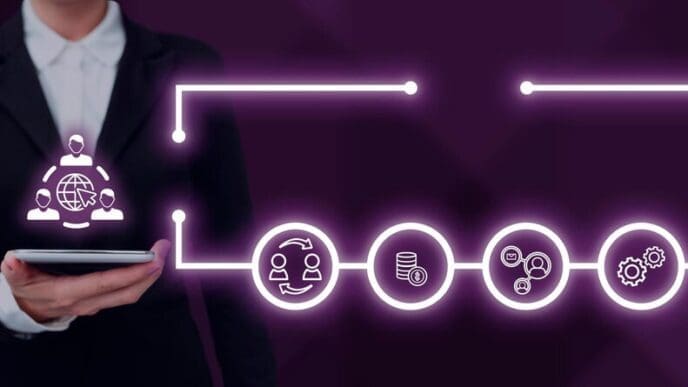 A businessman in a suit holds an open palm, symbolizing successful teamwork and accomplishment.