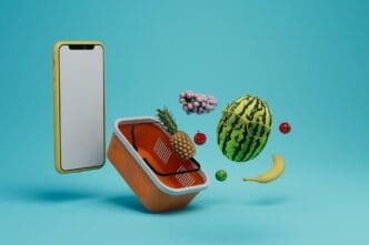 A person uses a smartphone to order fruit, with a large basket of fruits in the background.