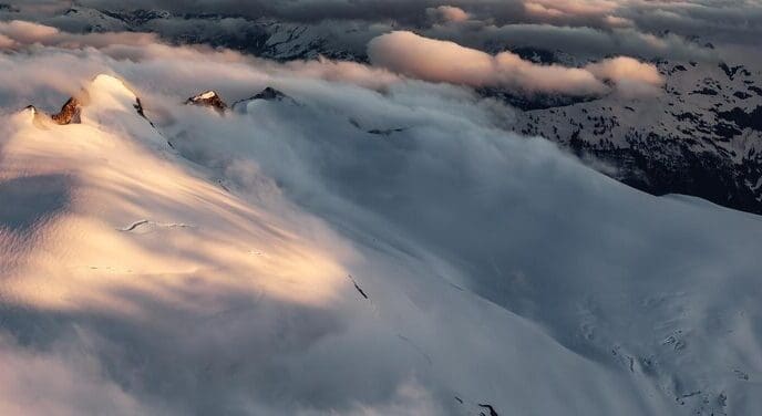Aerial panoramic view of a Canadian mountain landscape at sunset.