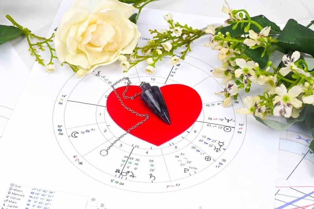A white circle features a red heart in the center and a smaller red heart above it.