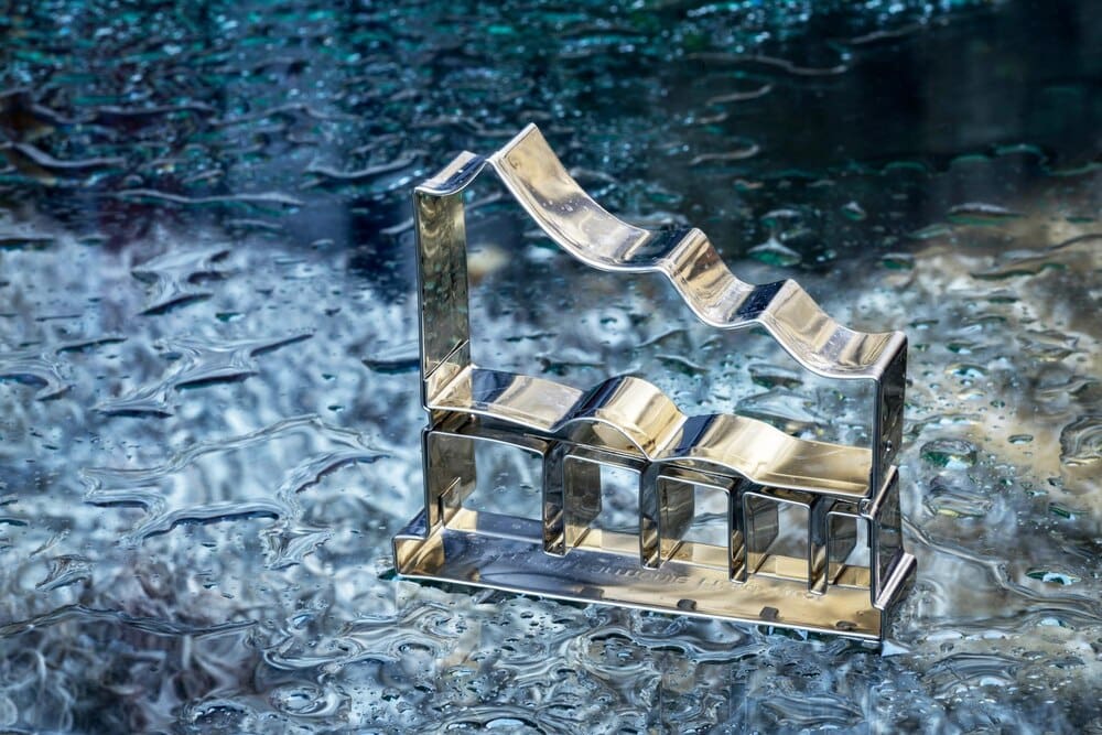 Close-up of metallic equipment floating on water.