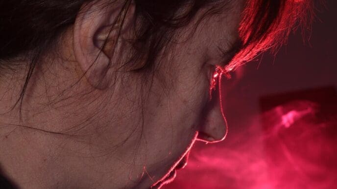 Close-up portrait of a woman with red hair.