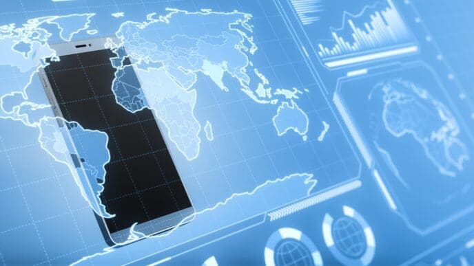 Close-up of a smartphone displays glowing digital business charts and a map interface against a blurry background, suggesting military control and espionage.