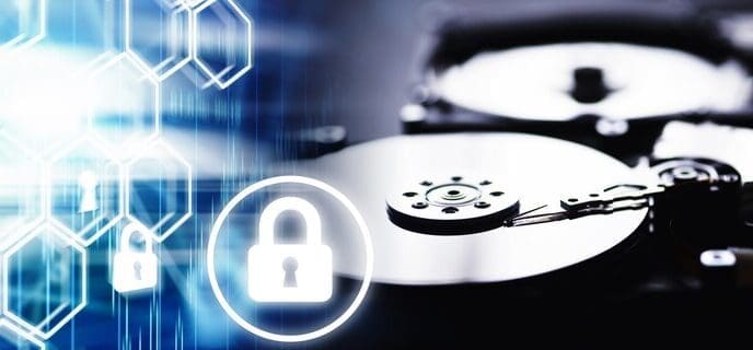 A disassembled hard drive and computer components are arranged against a computer-themed background.