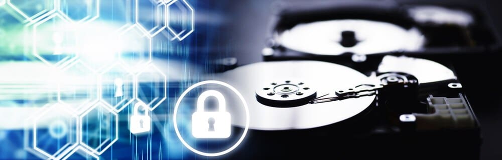 A disassembled hard drive and computer components are arranged against a computer-themed background.