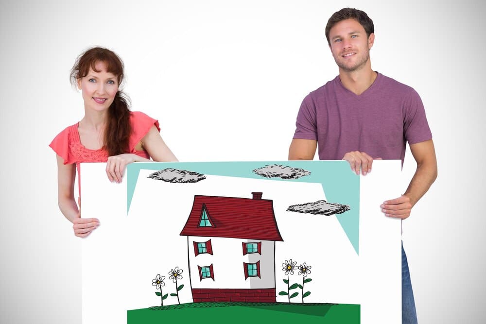 A smiling couple poses together, looking directly at the camera against a softly blurred, white background.