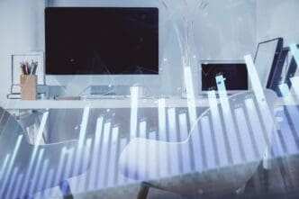 Double exposure of a stock market graph overlaid on an office interior, illustrating financial analysis.