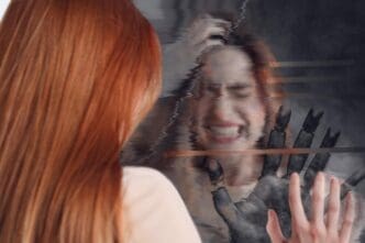 A young woman with a distressed expression touches a shattered mirror, with a glitch effect applied to the background.
