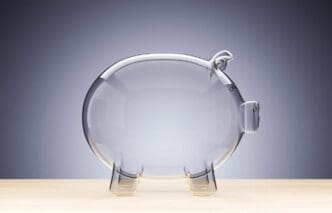 A transparent glass piggy bank is empty, rendered in 3D.