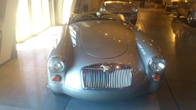 An exhibit showcases a collection of classic automobiles.
