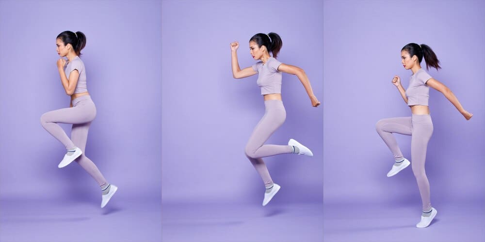 A full-length shot features a slim Asian woman in athletic wear performing a warm-up stretch with spring jumps against a purple background.