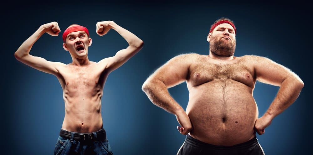 A group of geeks, some fat and some thin, flex their muscles in a humorous pose.