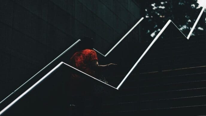 High-angle shot of a bird perched on a railing.