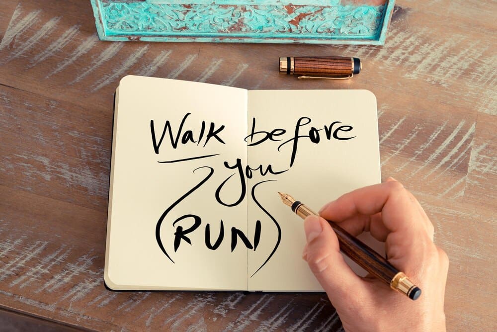 Close-up, high-angle shot of a person's hand holding a piece of paper.