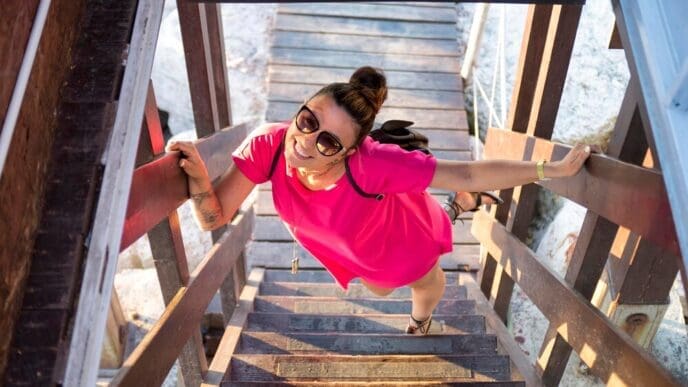 High-angle shot of a woman sitting on steps.