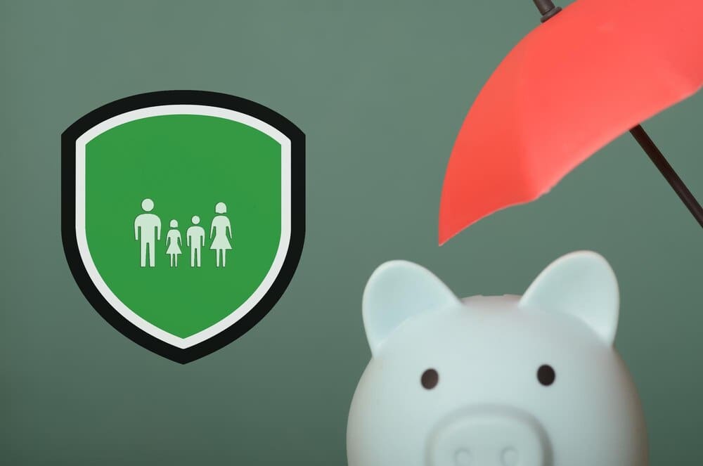 A family stands together under an umbrella and a shield, representing the idea of family protection.