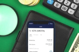 A person uses a mobile phone to access an online banking platform with cryptocurrency trading features.