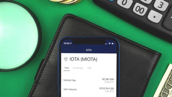 A person uses a mobile phone to access an online banking platform with cryptocurrency trading features.