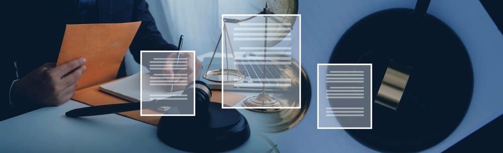 A male judge and a male lawyer are in a courtroom, likely discussing legal matters.