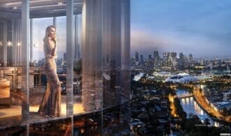 Modern, high-rise apartment in Melbourne with floor-to-ceiling windows overlooking the city.