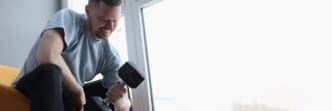 Man performing bicep curls with dumbbells.