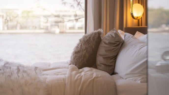 A man is asleep on a bed.