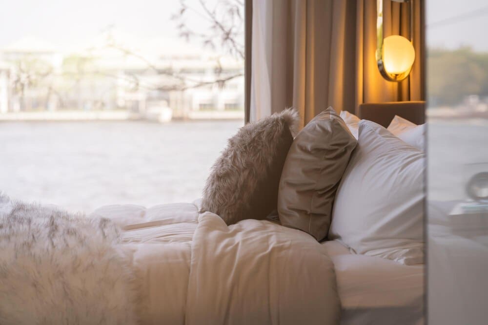 A man is asleep on a bed.