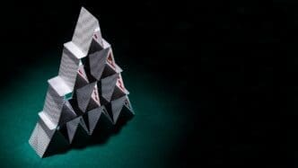 Close-up of a modern poker card arrangement, showing the suits and values.