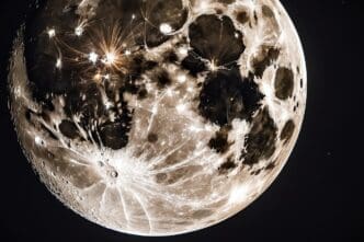 A full moon shines brightly in the night sky over a natural outdoor setting.