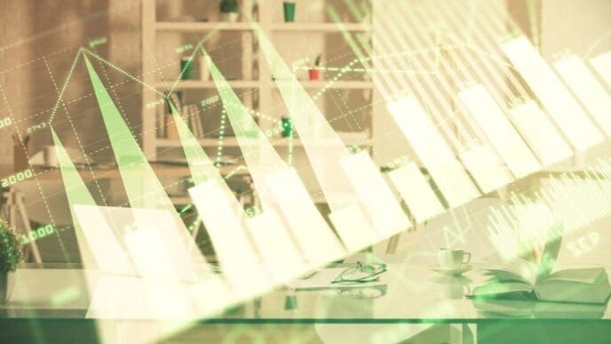 A multi-exposure image shows a stock market chart overlaid on an office interior, illustrating financial analysis concepts.