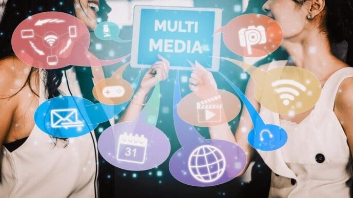 A colorful graphic depicts interconnected icons representing multimedia and computer applications.