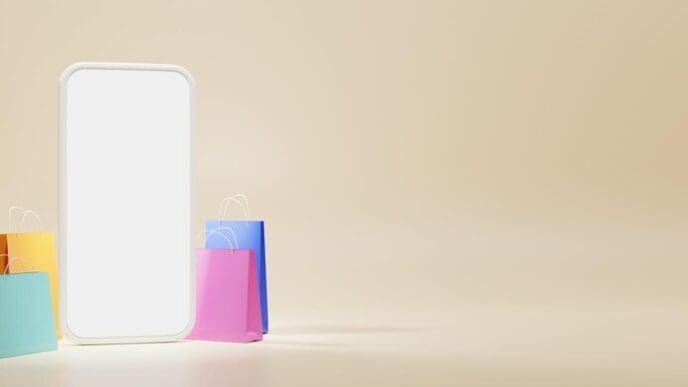 A smartphone displays a blank screen surrounded by colorful gift bags on a beige background, representing an online shopping and loyalty program concept.
