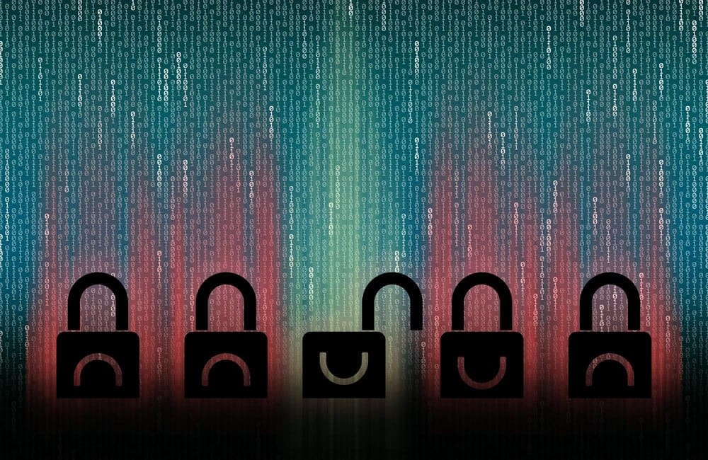 An open padlock stands out among closed padlocks against a background of binary code.