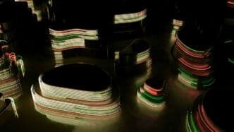 Dark oval-shaped designs with neon lines move across a surface.
